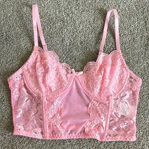 Baby pink lace corset-like crop.